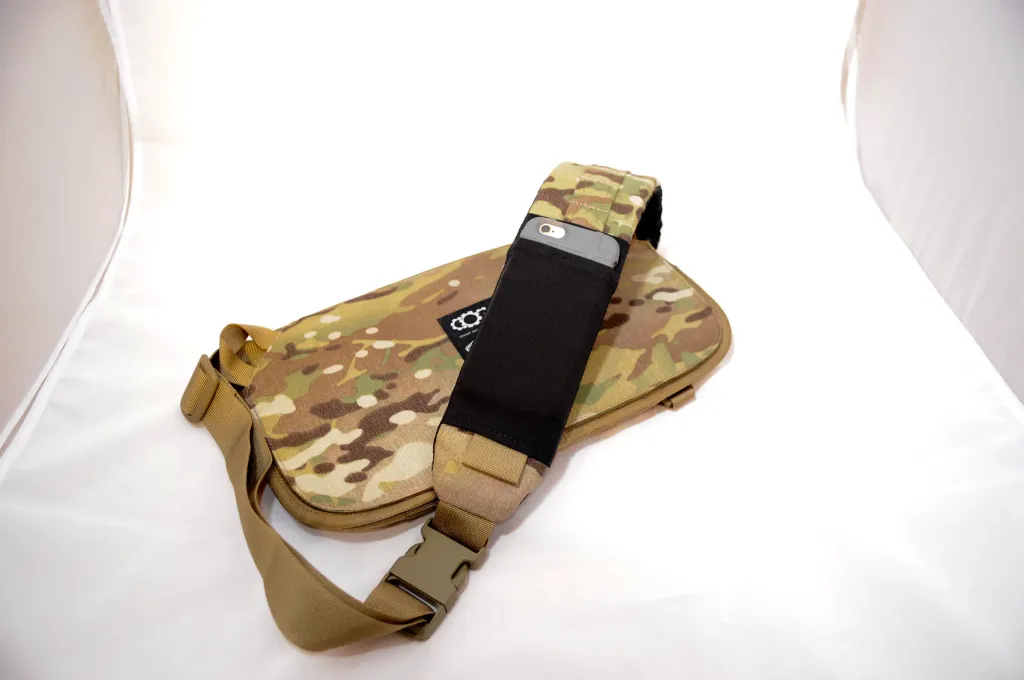 The Multicam bag with a phone tucked into a stretch pocket on its shoulder strap