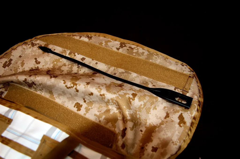 Interior zipper pocket on the digital-camo lining under a hook-and-loop strap